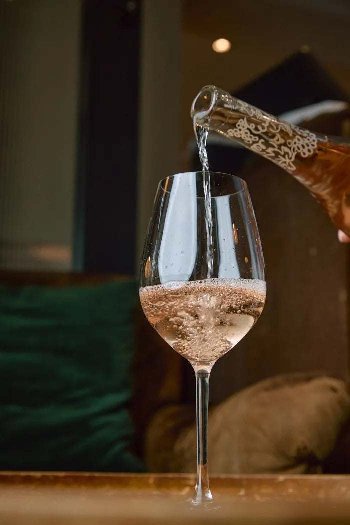 Folc rosé poured into a glass indoors