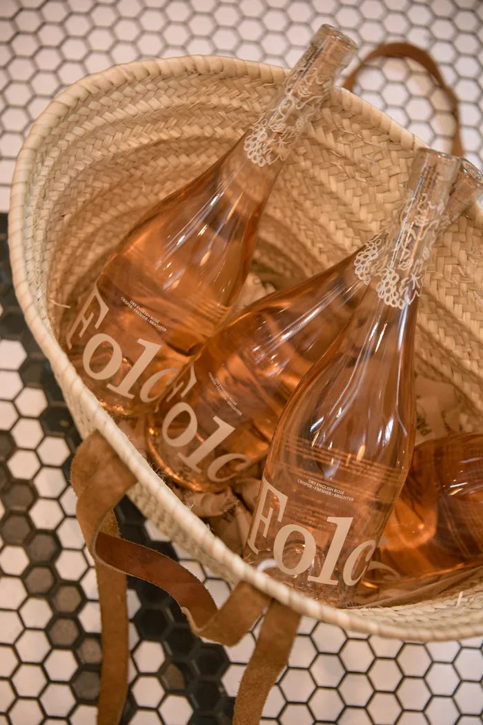 Three bottles of Folc rosé in a basket